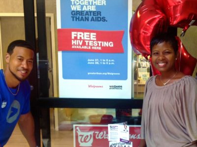 People standing with Free HIV testing sign
