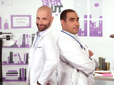 Two HIV specialists standing back to back in an office